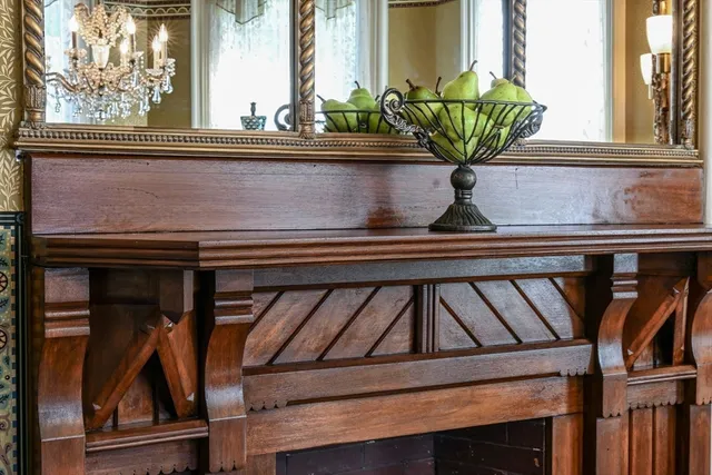 a vase of flowers sitting on a shelf