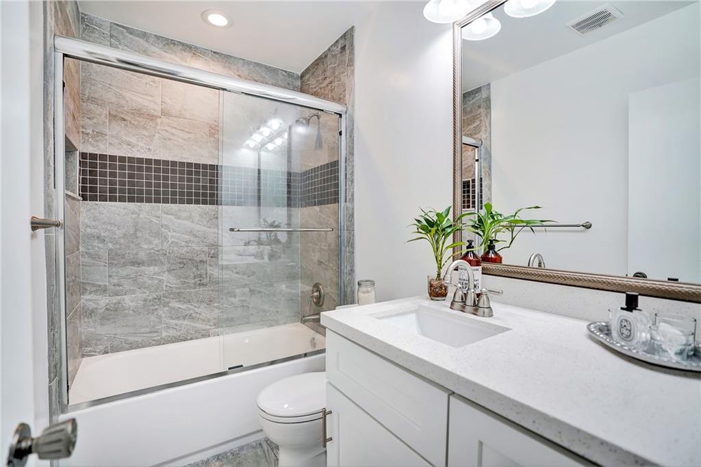 5700 Northeast 22nd Way, Unit 322 Fort Lauderdale, FL 33308 - Photo 12 of 19 a bathroom with a sink toilet and shower