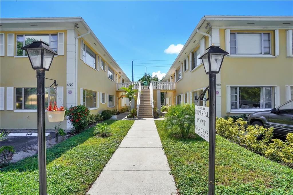 5700 Northeast 22nd Way, Unit 322 Fort Lauderdale, FL 33308 - Photo 17 of 19 a front view of a house with garden