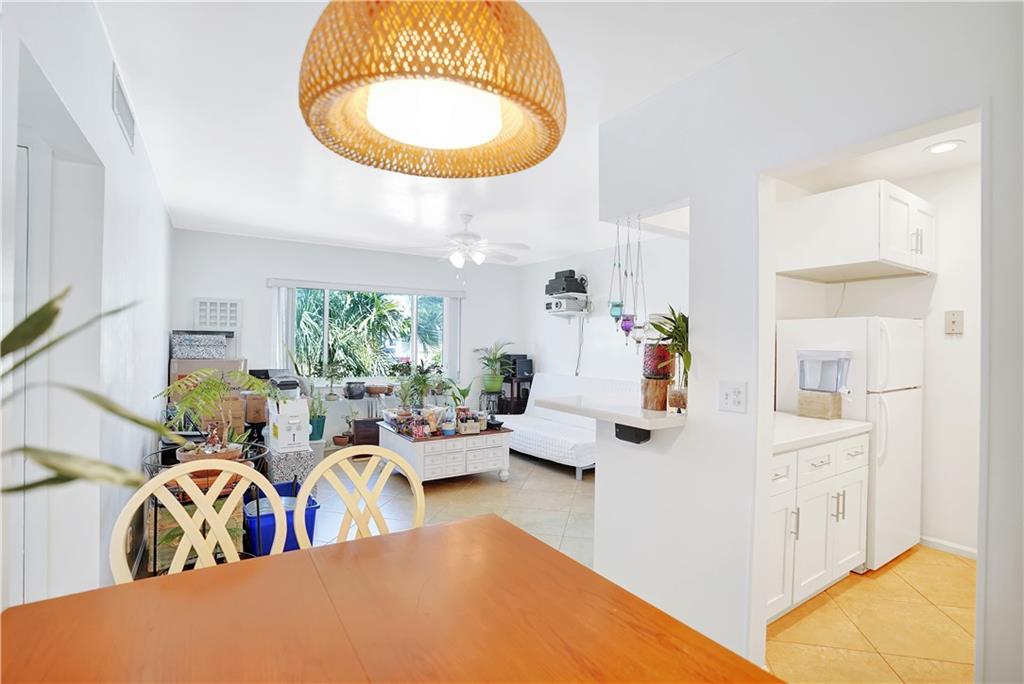 5700 Northeast 22nd Way, Unit 322 Fort Lauderdale, FL 33308 - Photo 8 of 19 a bed room with a bed and a mirror