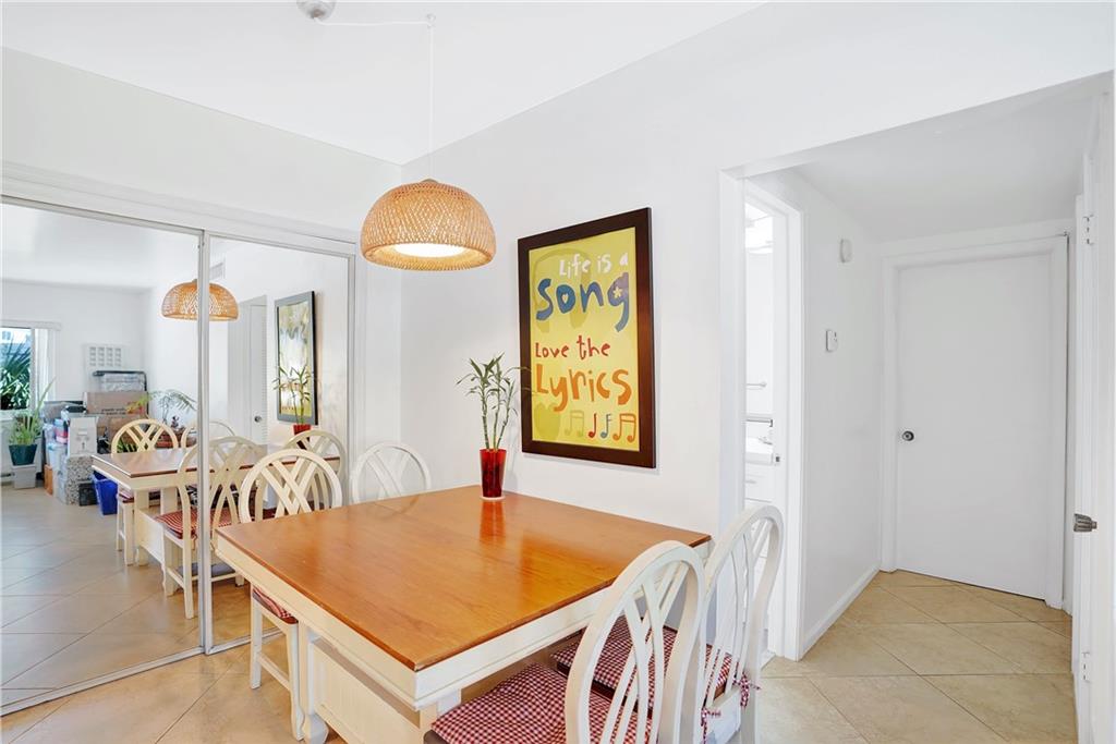 5700 Northeast 22nd Way, Unit 322 Fort Lauderdale, FL 33308 - Photo 10 of 19 a view of a livingroom with furniture and windows
