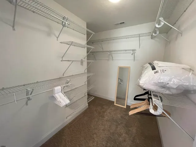 a view of a room with racks on the wall