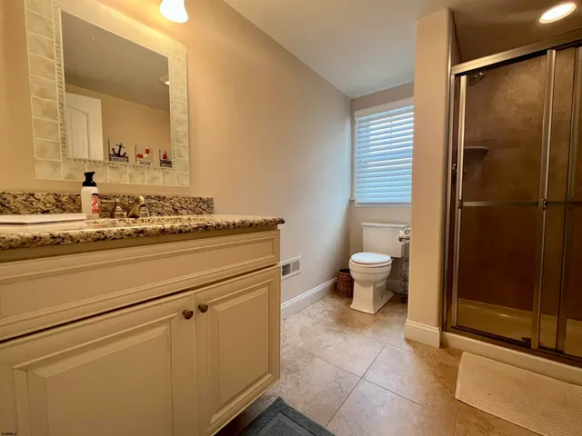 a view of a chairs and table in a patio