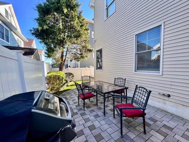 a view of a chairs and table in a patio