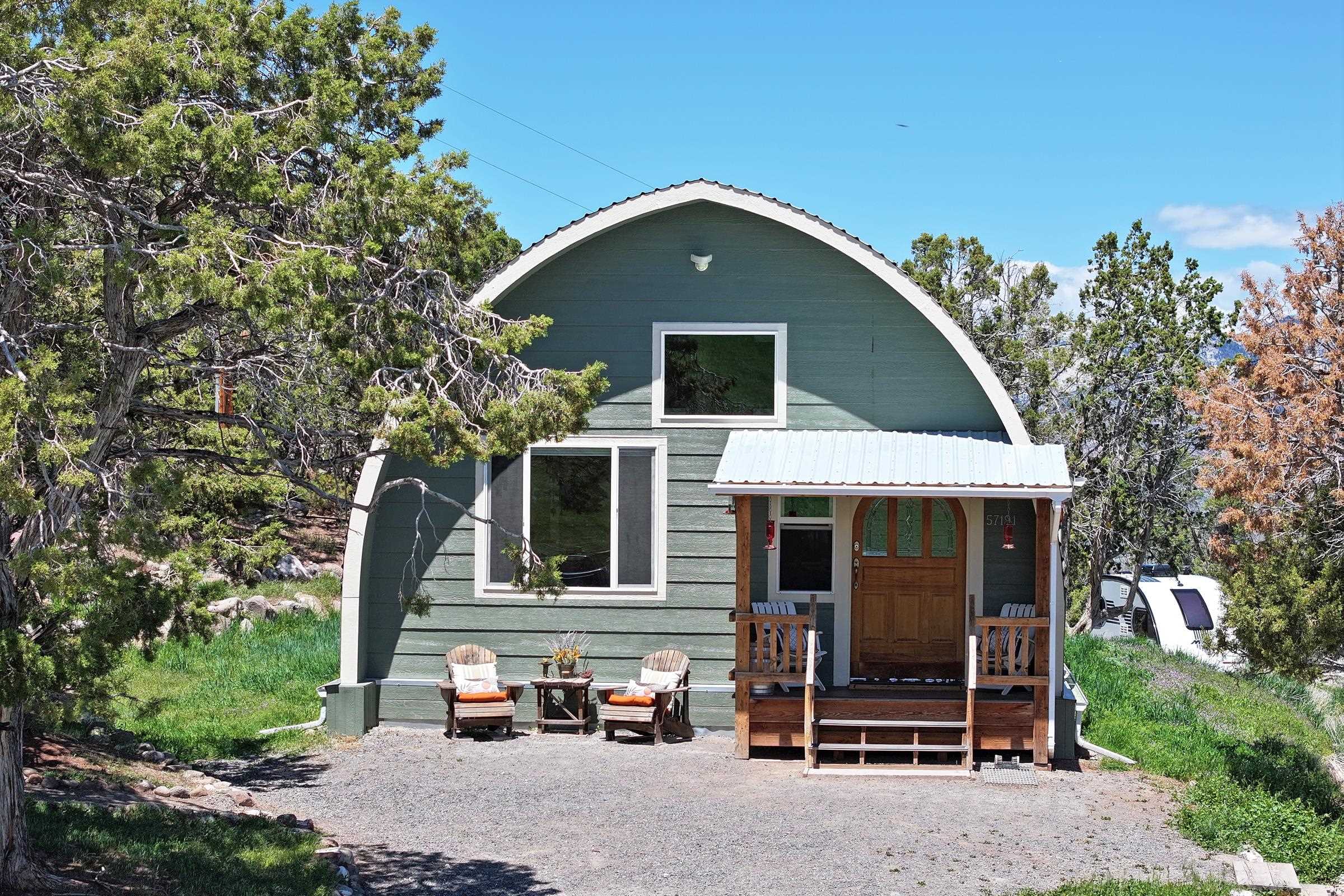 57191 Me Road Collbran, CO 81624 - Photo 2 of 42 a front view of a house with a yard