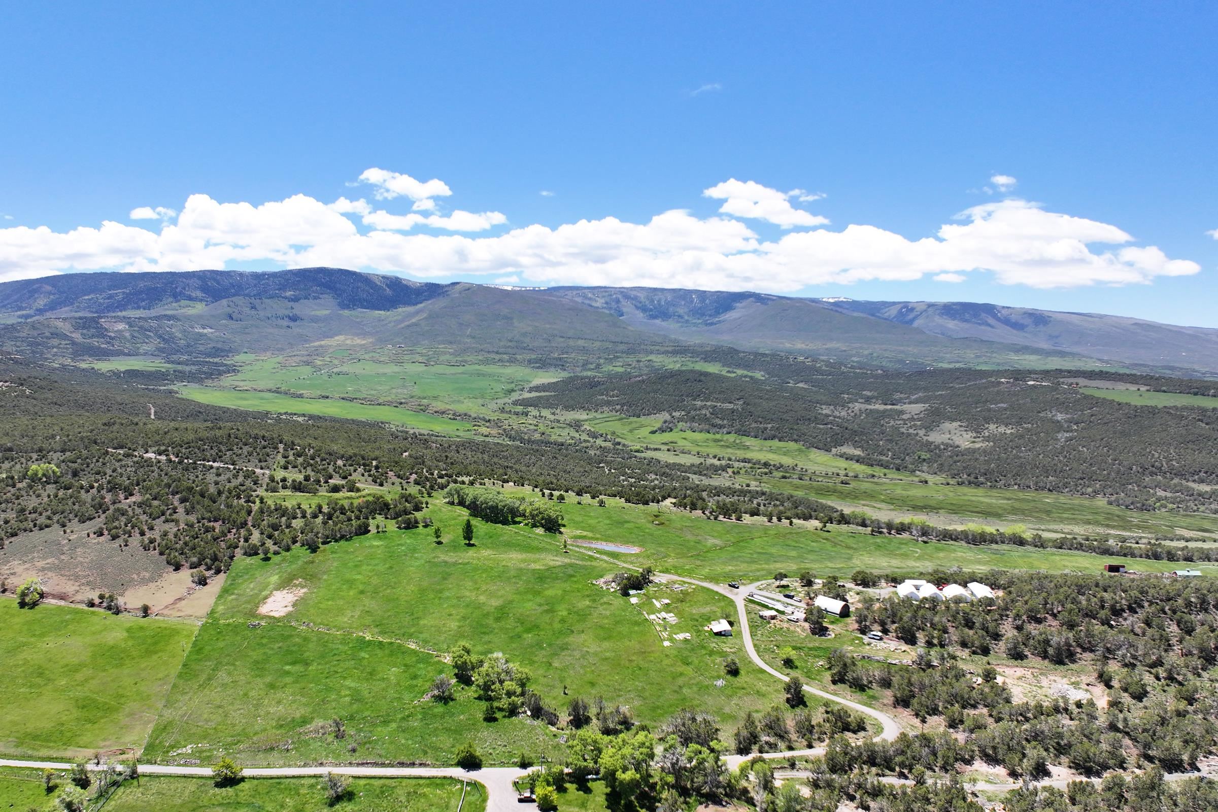 57191 Me Road Collbran, CO 81624 - Photo 6 of 42 a view of a town with mountains in the background