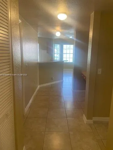 a view of hallway with a window