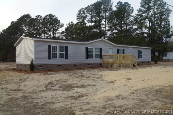 a house with trees in the background