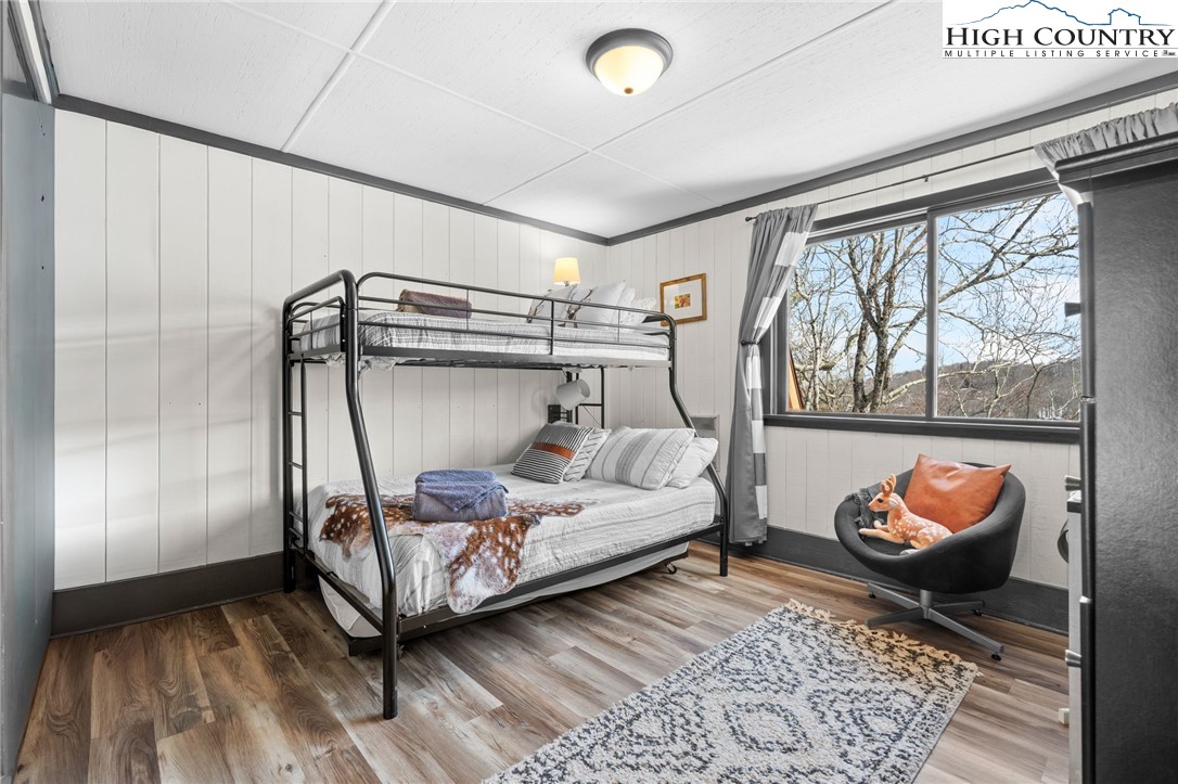 220 Charter Hills Road, Unit C2 Beech Mountain, NC 28604 - Photo 19 of 26 a bedroom with a bed and a window