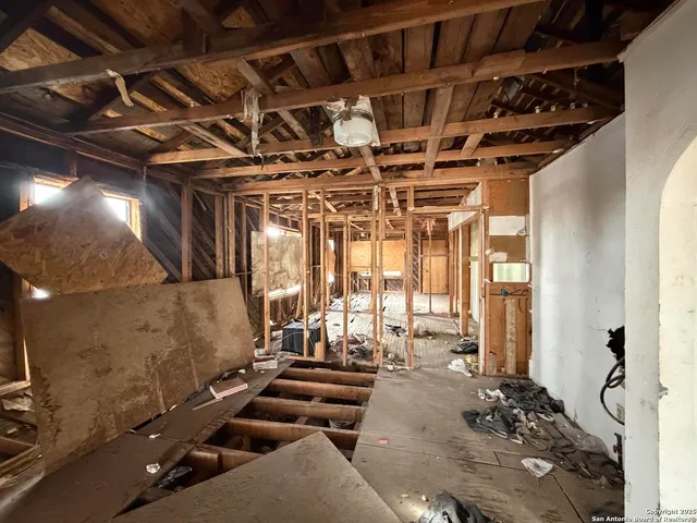 a view of a patio with a table and chairs