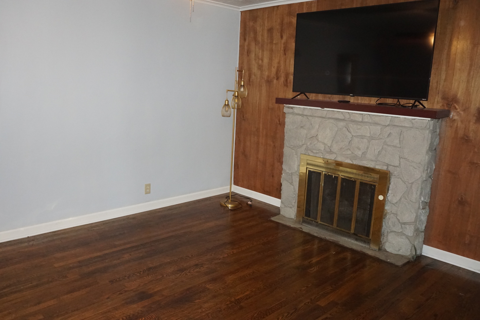 14542 Turner Avenue Midlothian, IL 60445 - Photo 7 of 22 a view of a livingroom with wooden floor and a fireplace