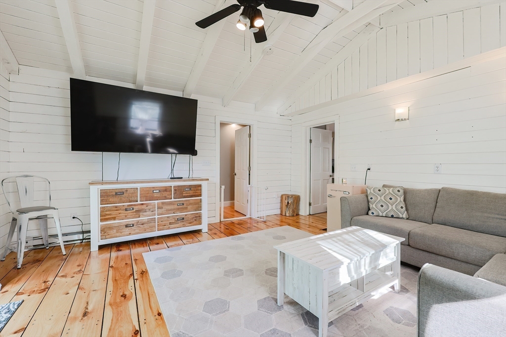 321 Shears Street Wrentham, MA 02093 - Photo 14 of 39 a living room with furniture and a flat screen tv