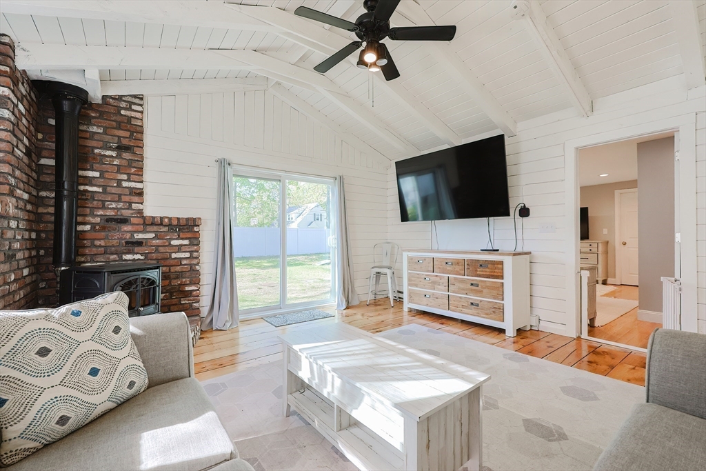 321 Shears Street Wrentham, MA 02093 - Photo 15 of 39 a living room with furniture and a flat screen tv