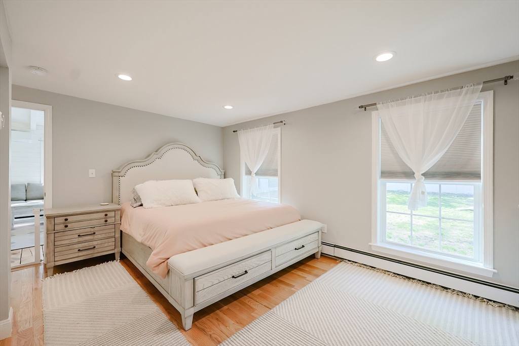 321 Shears Street Wrentham, MA 02093 - Photo 16 of 39 a bedroom with a bed and a large window