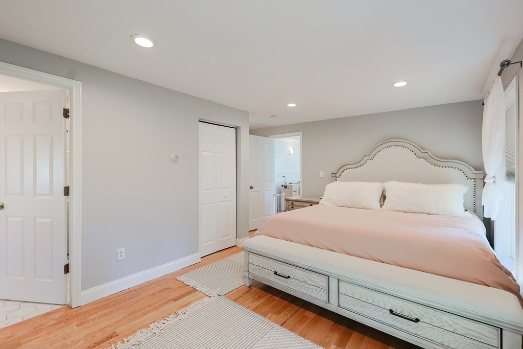 321 Shears Street Wrentham, MA 02093 - Photo 17 of 39 a bedroom with a bed and a night stand