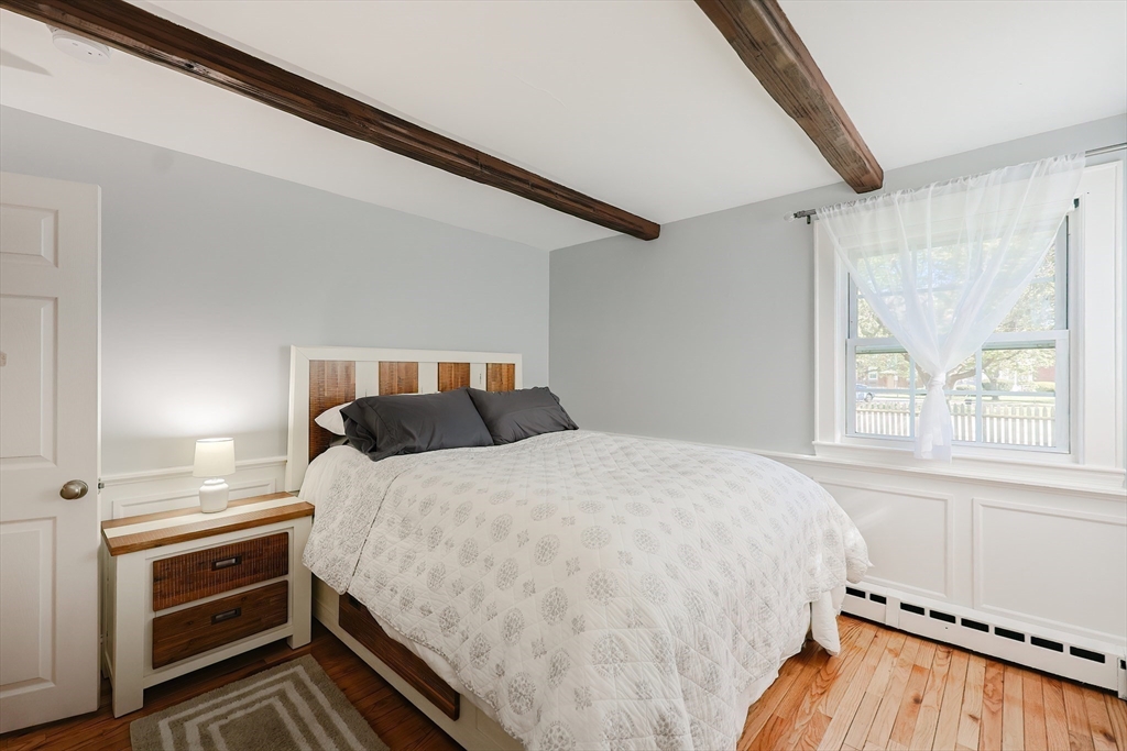321 Shears Street Wrentham, MA 02093 - Photo 18 of 39 a bedroom with a bed and a window