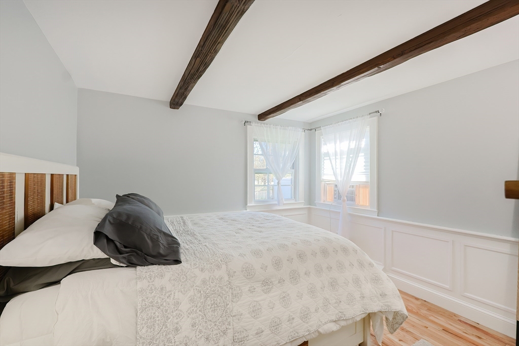 321 Shears Street Wrentham, MA 02093 - Photo 19 of 39 a bedroom with a bed and a window