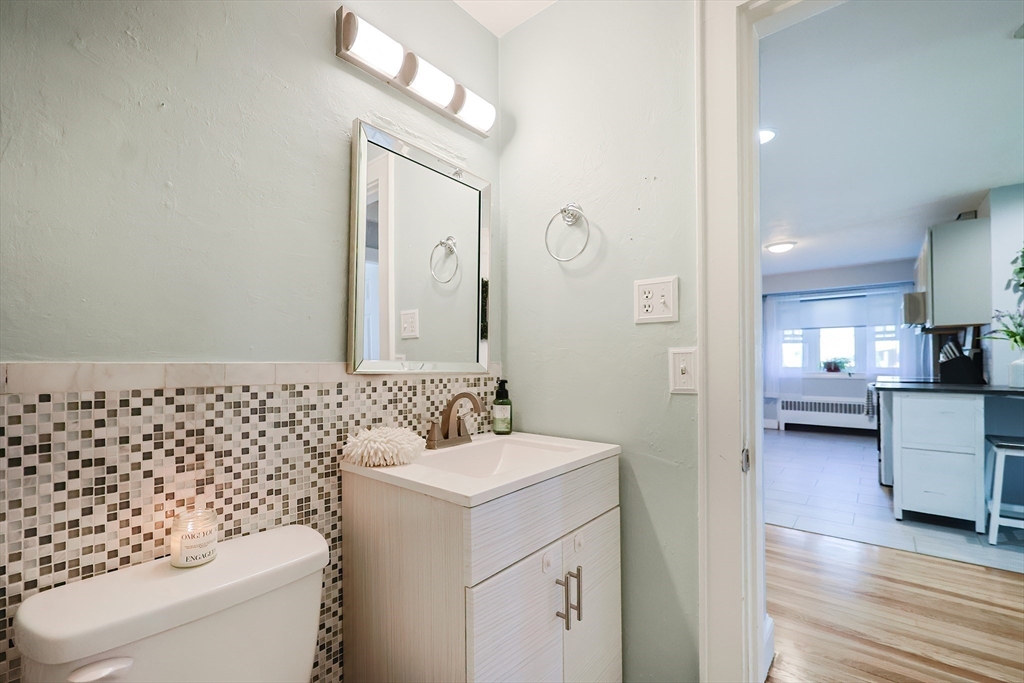 321 Shears Street Wrentham, MA 02093 - Photo 20 of 39 a bathroom with a sink a toilet and a mirror