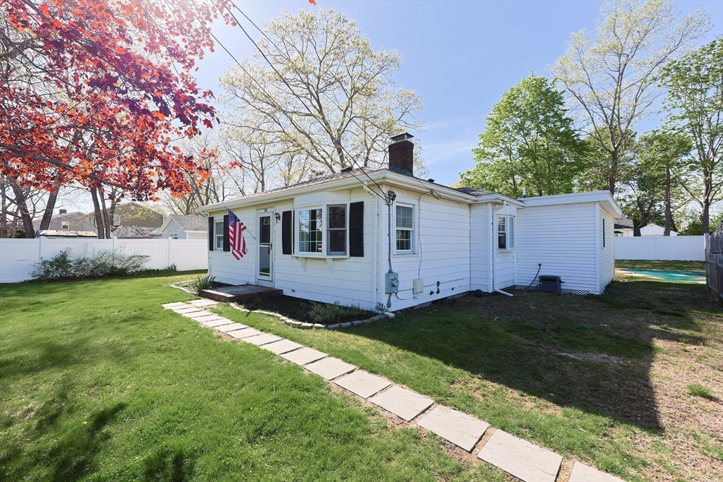 321 Shears Street Wrentham, MA 02093 - Photo 2 of 39 a front view of a house with a garden