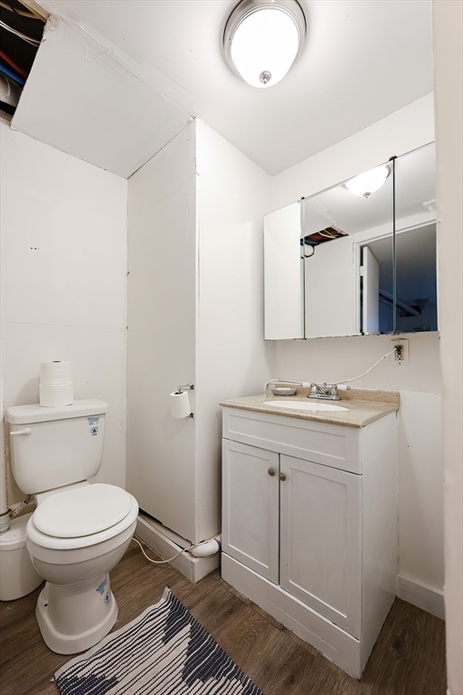 321 Shears Street Wrentham, MA 02093 - Photo 30 of 39 a bathroom with a granite countertop toilet sink and mirror