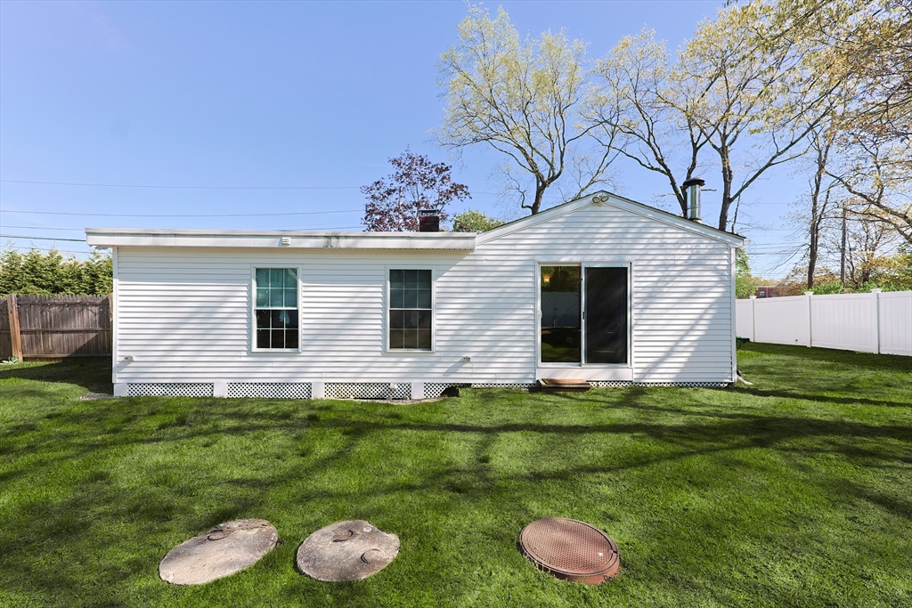 321 Shears Street Wrentham, MA 02093 - Photo 33 of 39 a backyard of a house with lots of green space and outdoor seating