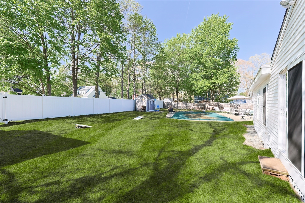 321 Shears Street Wrentham, MA 02093 - Photo 34 of 39 a view of yard with swimming pool and green space