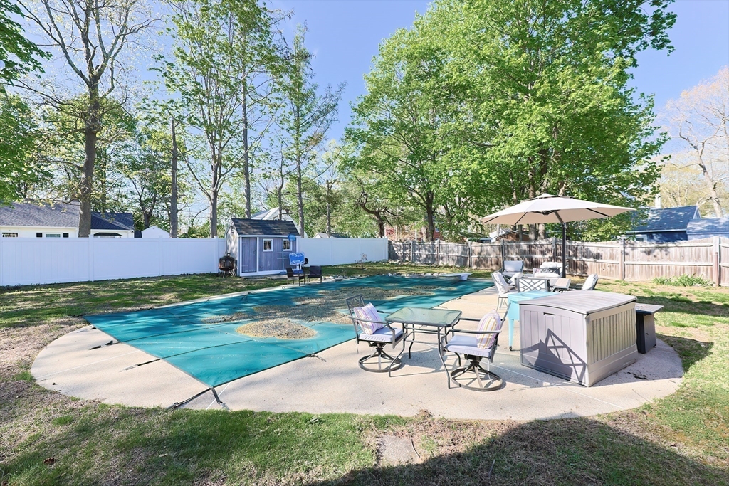 321 Shears Street Wrentham, MA 02093 - Photo 35 of 39 a view of a backyard with sitting area and furniture
