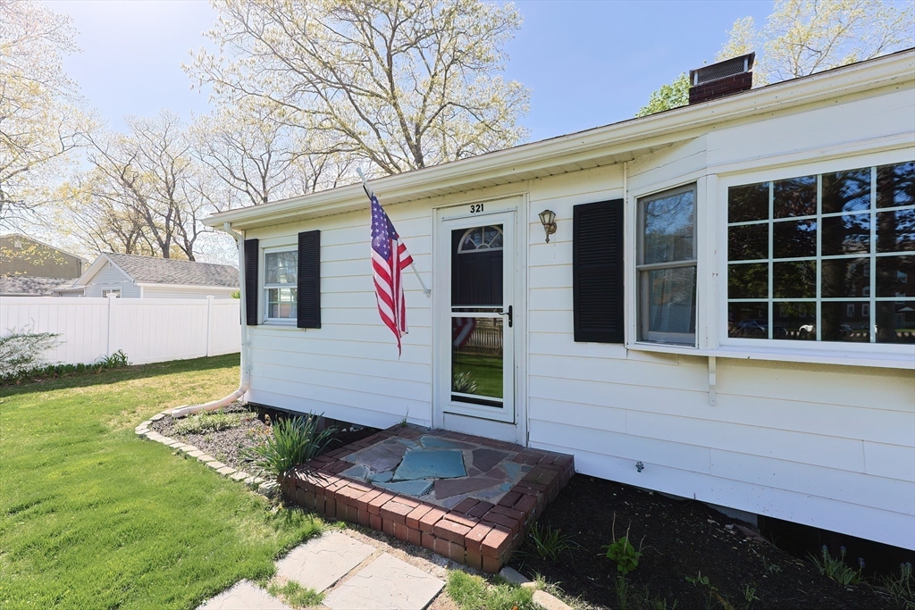 321 Shears Street Wrentham, MA 02093 - Photo 4 of 39 a front view of a house with garden