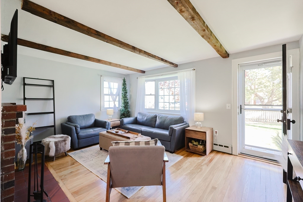 321 Shears Street Wrentham, MA 02093 - Photo 5 of 39 a living room with furniture and a window