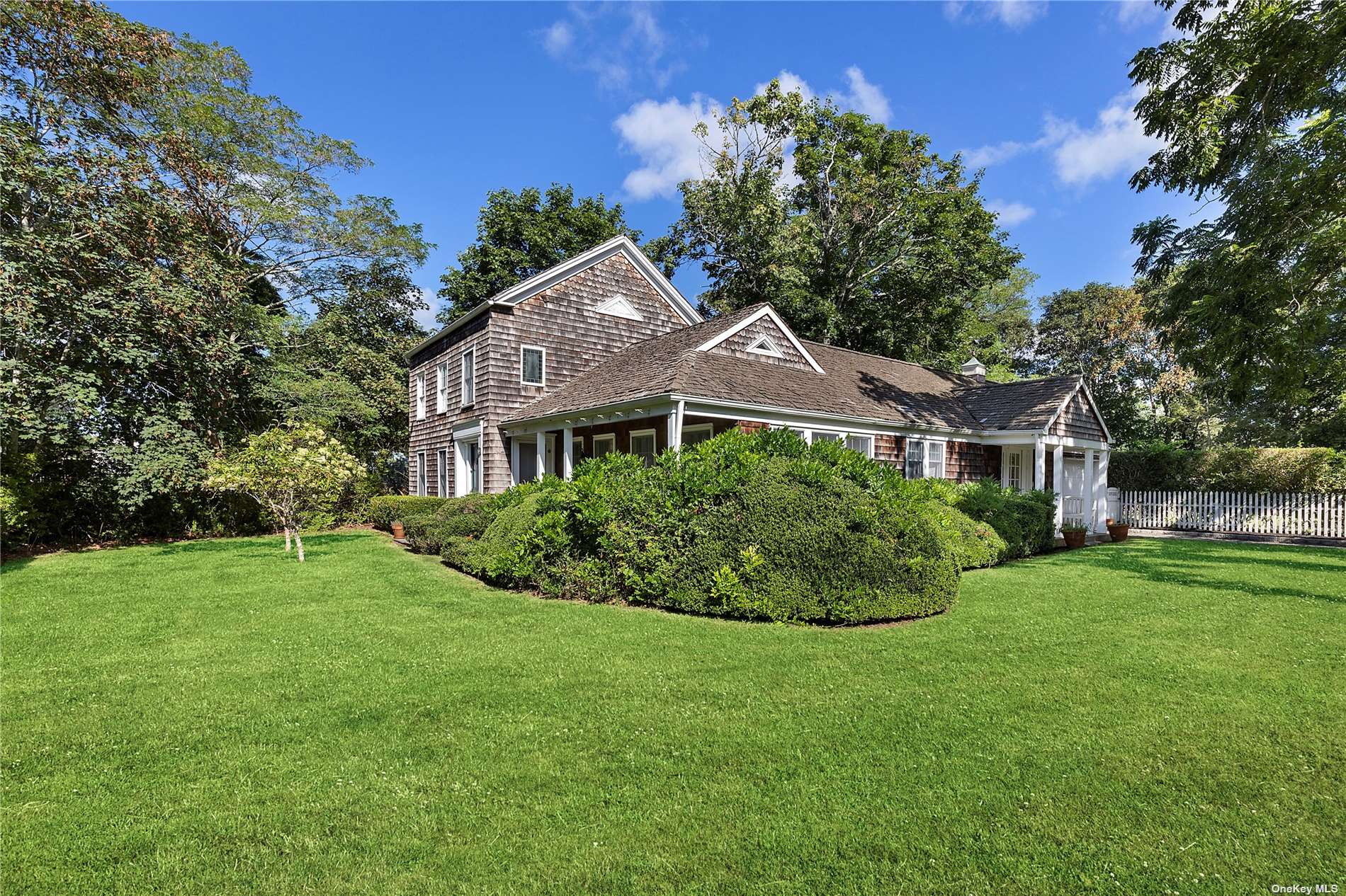 1 North Quarter Road Westhampton, NY 11977 - Photo 1 of 1 a front view of a house with a yard