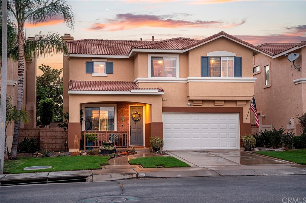 7654 Continental Place Rancho Cucamonga, CA 91730 - Photo 1 of 1 a front view of a house with a yard and garage