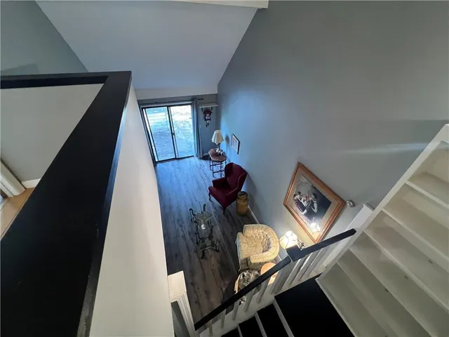 a view of walk in closet with a fan