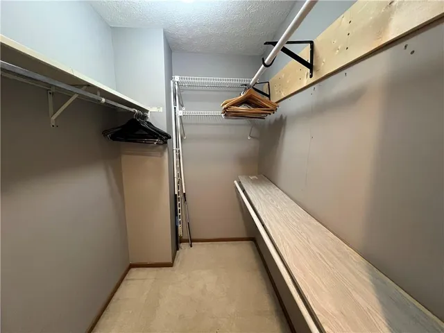 a bathroom with a sink a toilet a mirror and shower