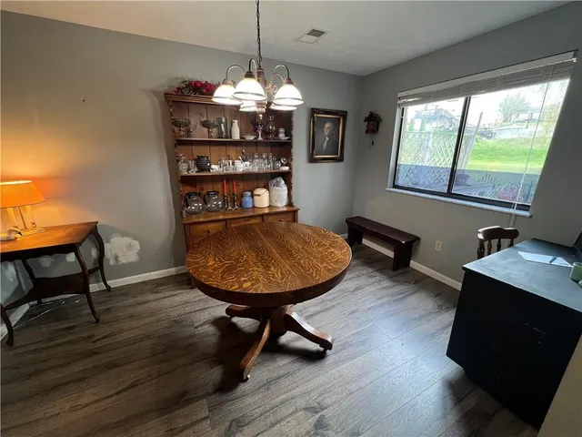 a view of a room with furniture window and wooden floor