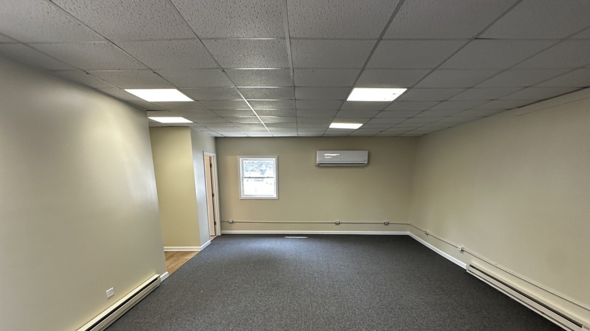 710 1/2 Liberty Street Morris, IL 60450 - Photo 4 of 10 an empty room with a empty space and windows