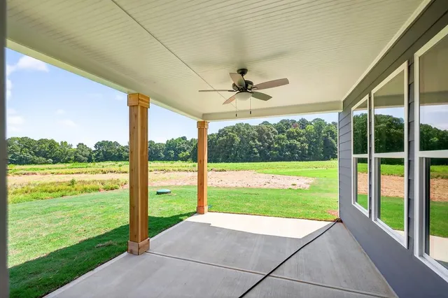 a front view of a house with a large window