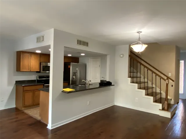 a kitchen with a stove and a refrigerator