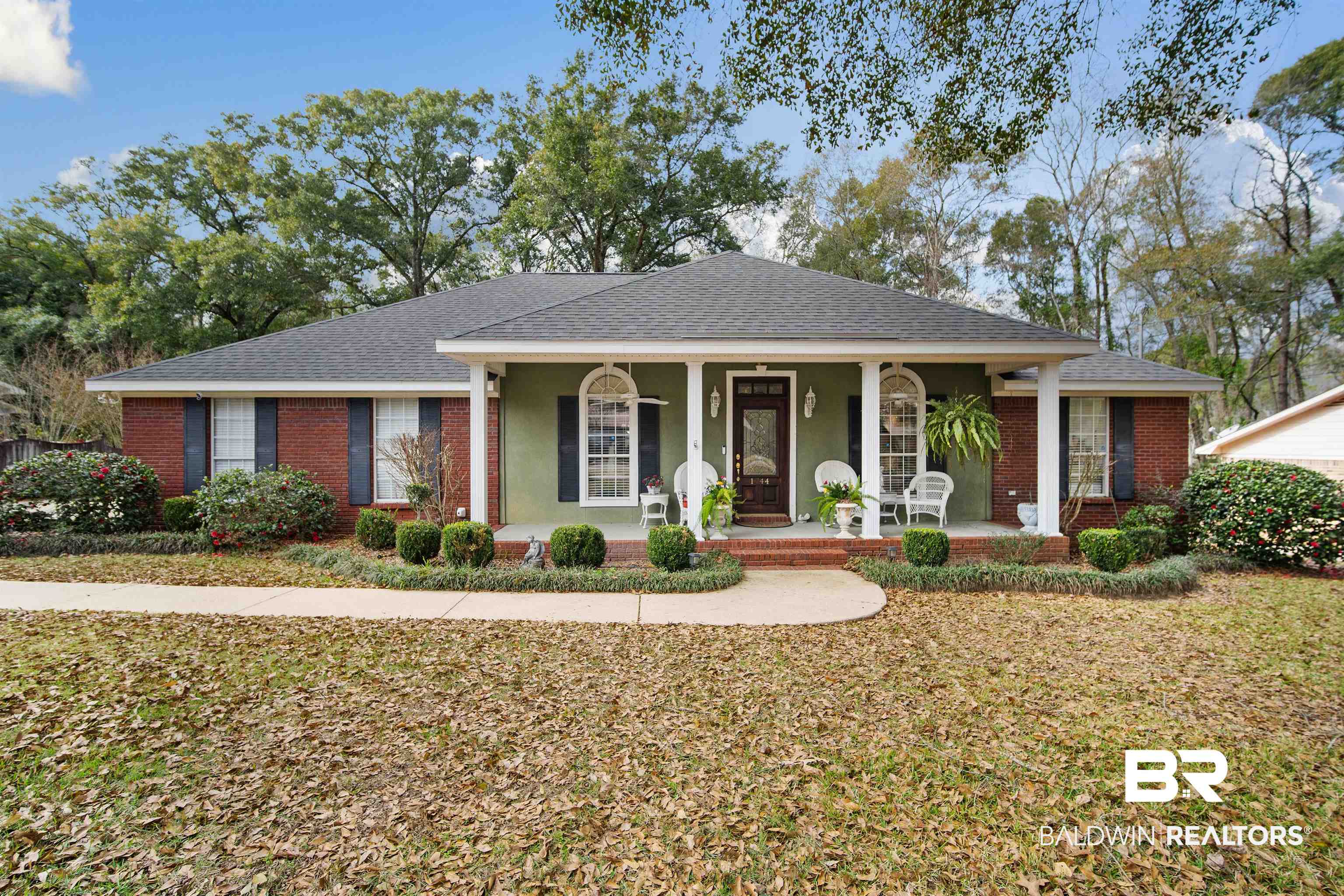1744 Aden Road Mobile, AL 36695 - Photo 1 of 35 Ranch-style home featuring a porch and a front lawn