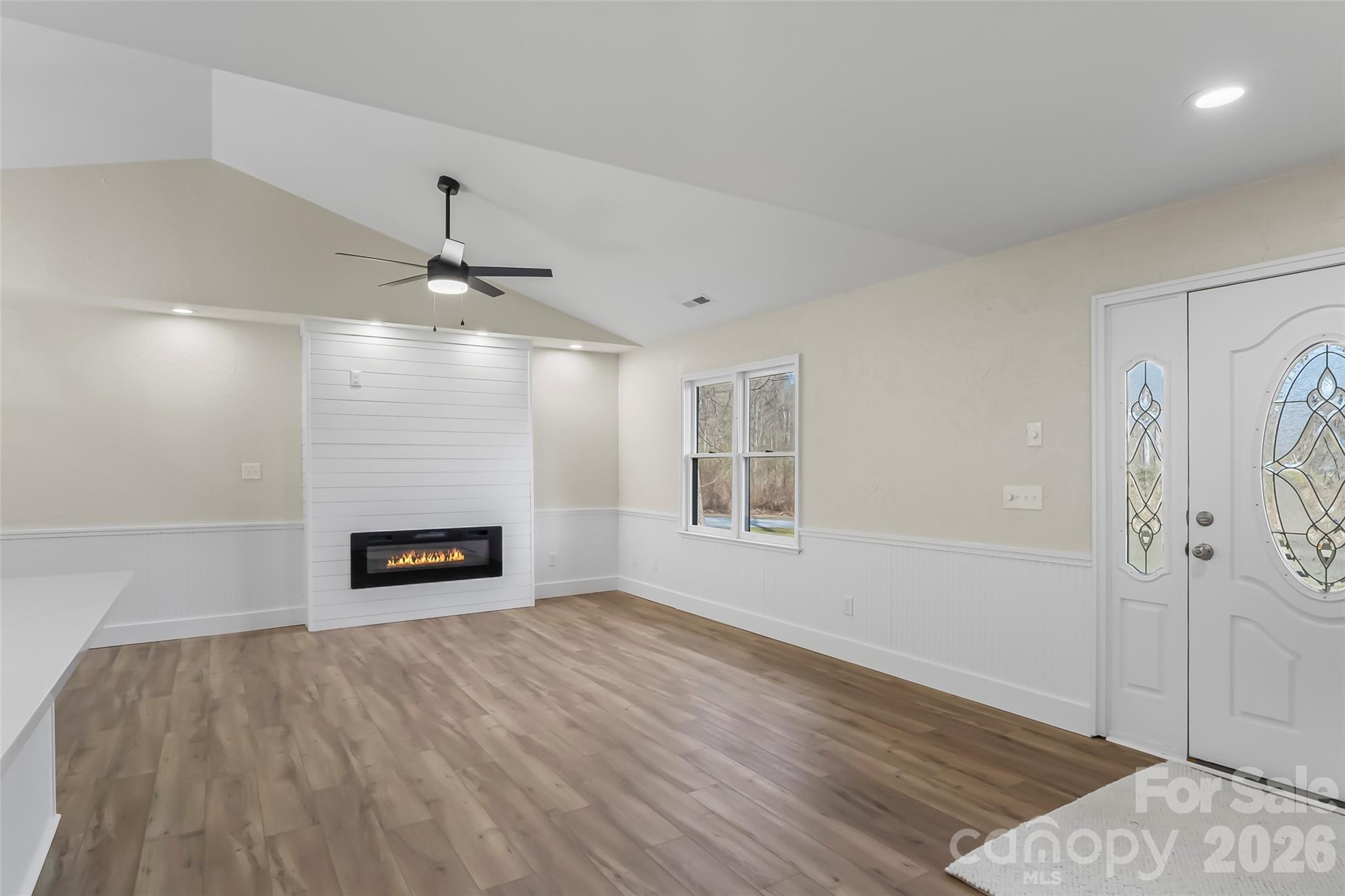 99 Hawkins Road Marion, NC 28752 - Photo 13 of 39 a view of empty room with wooden floor and window