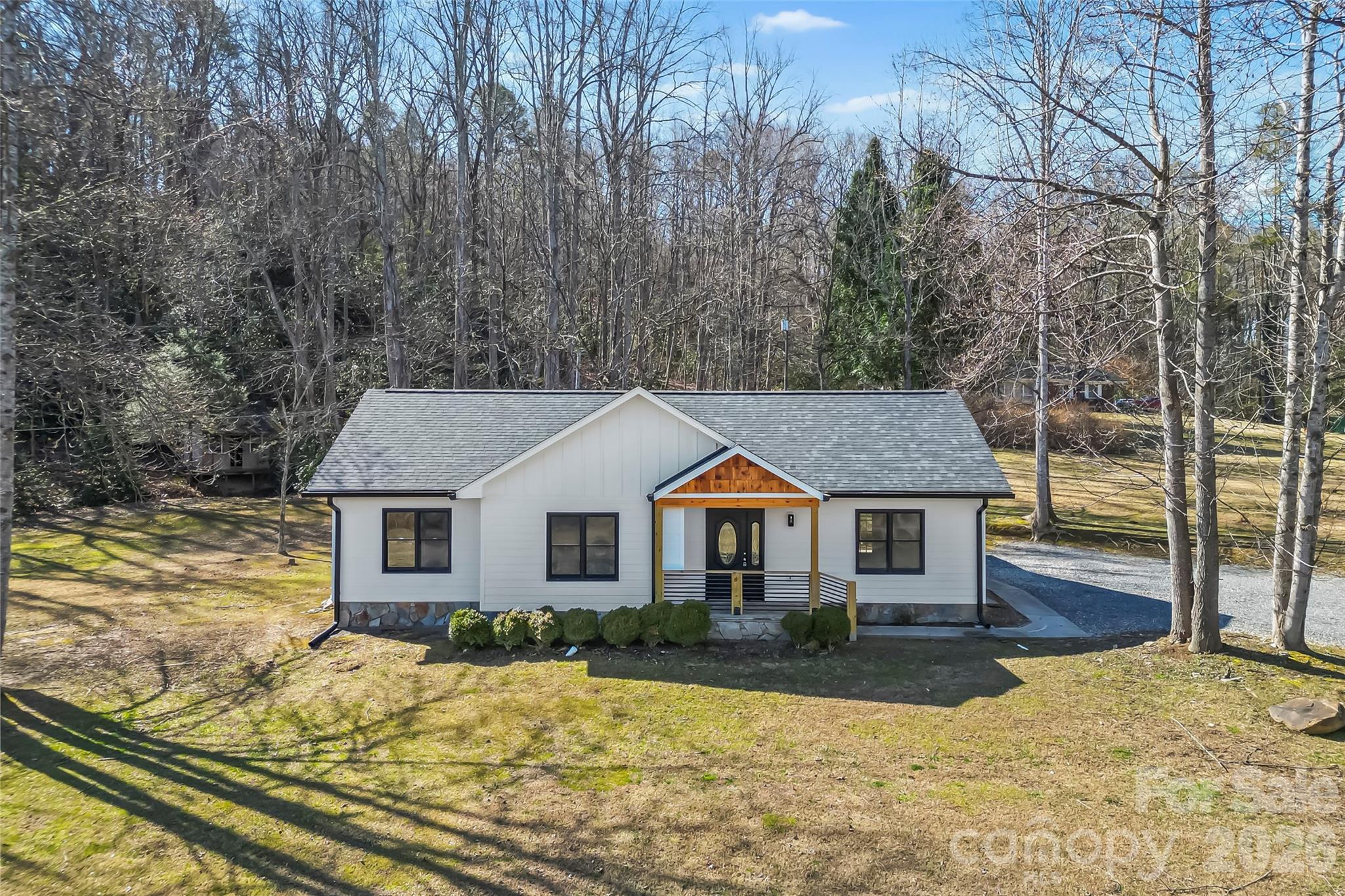 99 Hawkins Road Marion, NC 28752 - Photo 2 of 39 a front view of a house with a yard covered with snow