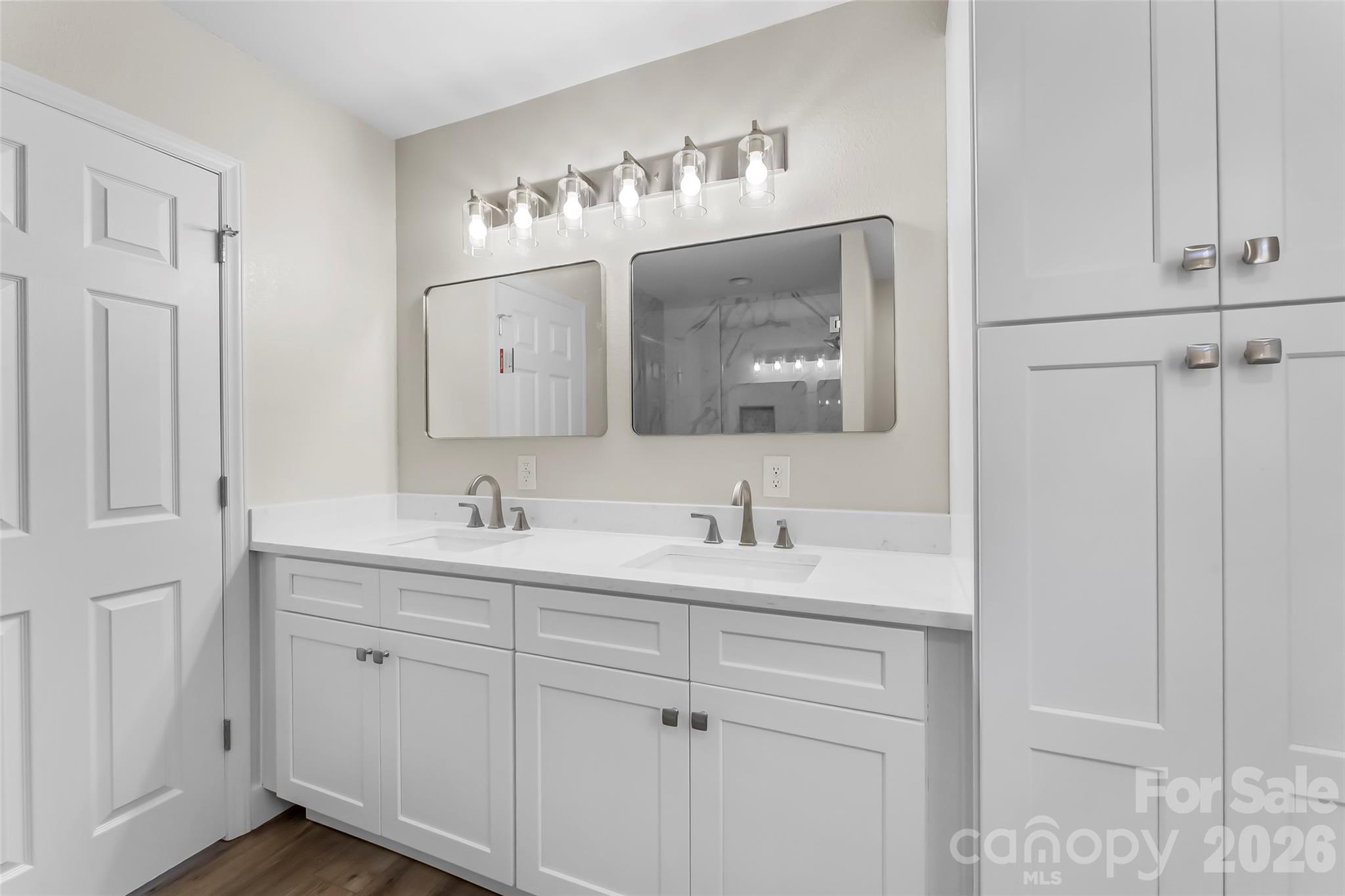 99 Hawkins Road Marion, NC 28752 - Photo 21 of 39 a bathroom with double sink a mirror and a