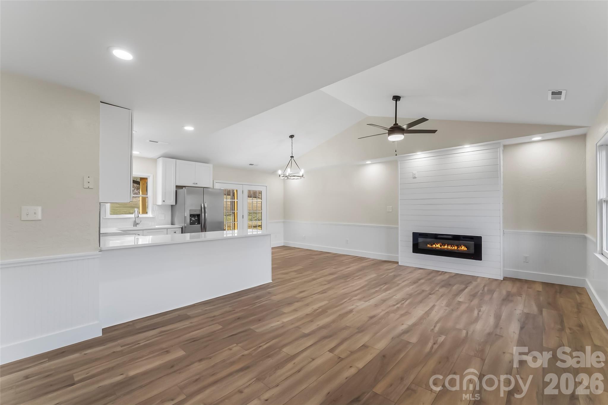 99 Hawkins Road Marion, NC 28752 - Photo 5 of 39 a view of kitchen with cabinets and wooden floor