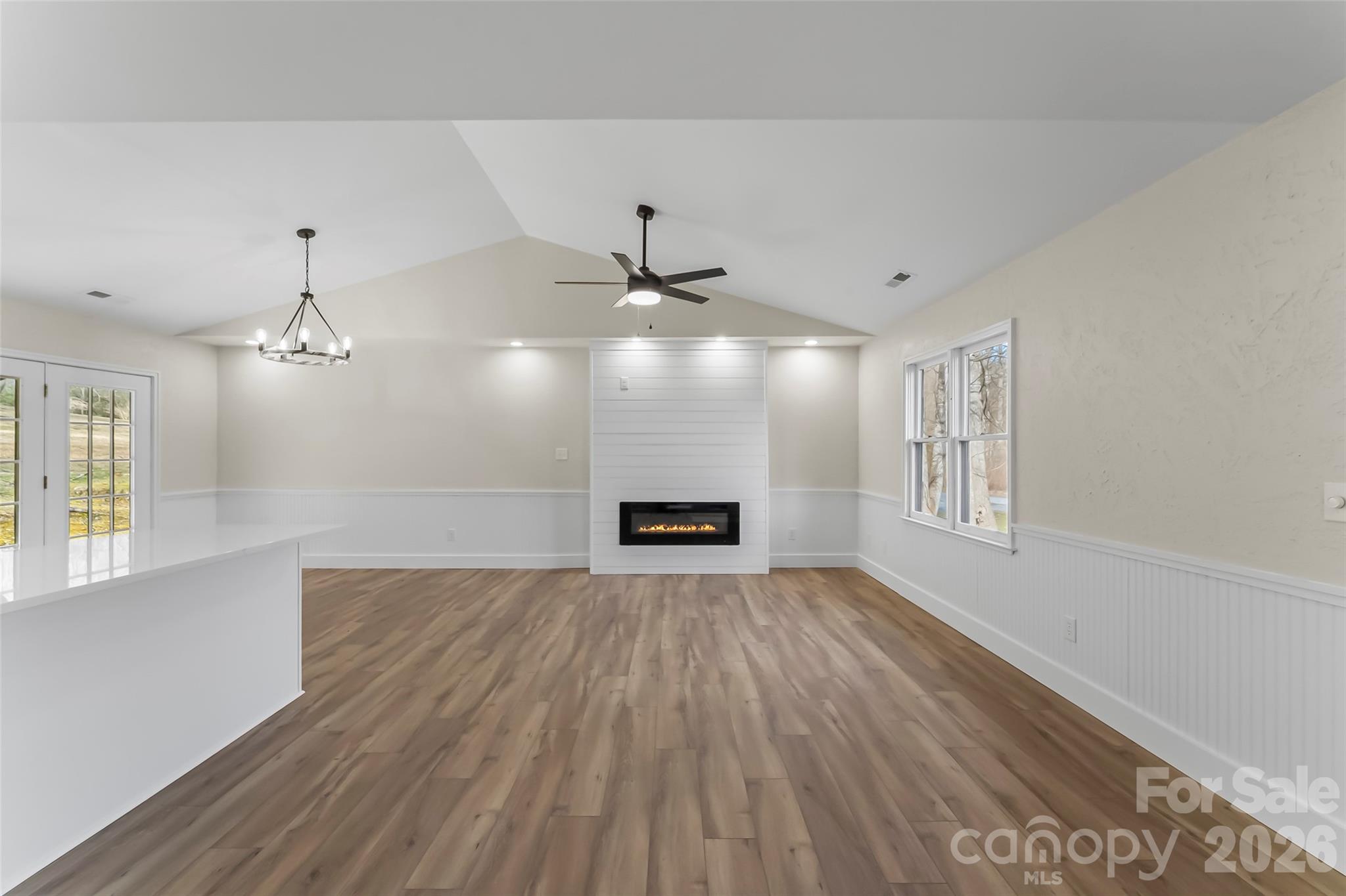 99 Hawkins Road Marion, NC 28752 - Photo 6 of 39 wooden floor in an empty room with a window