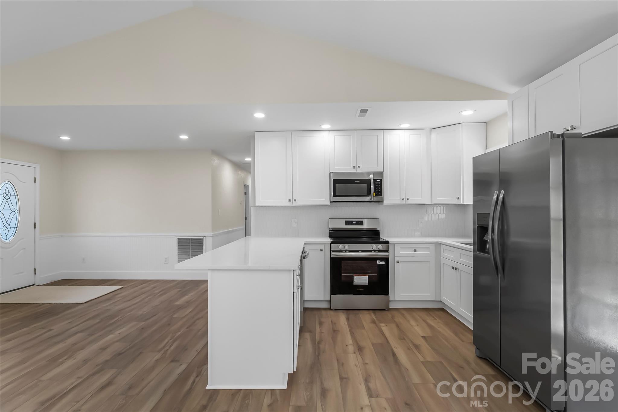 99 Hawkins Road Marion, NC 28752 - Photo 8 of 39 a kitchen with stainless steel appliances a refrigerator sink and stove