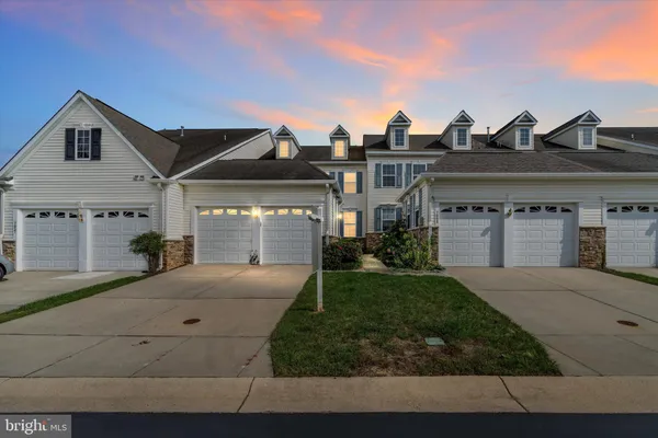 a front view of a house with garage
