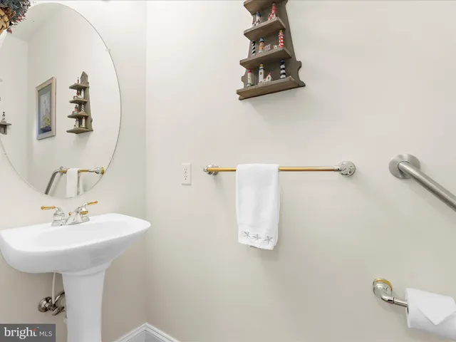 a bathroom with a sink and mirror