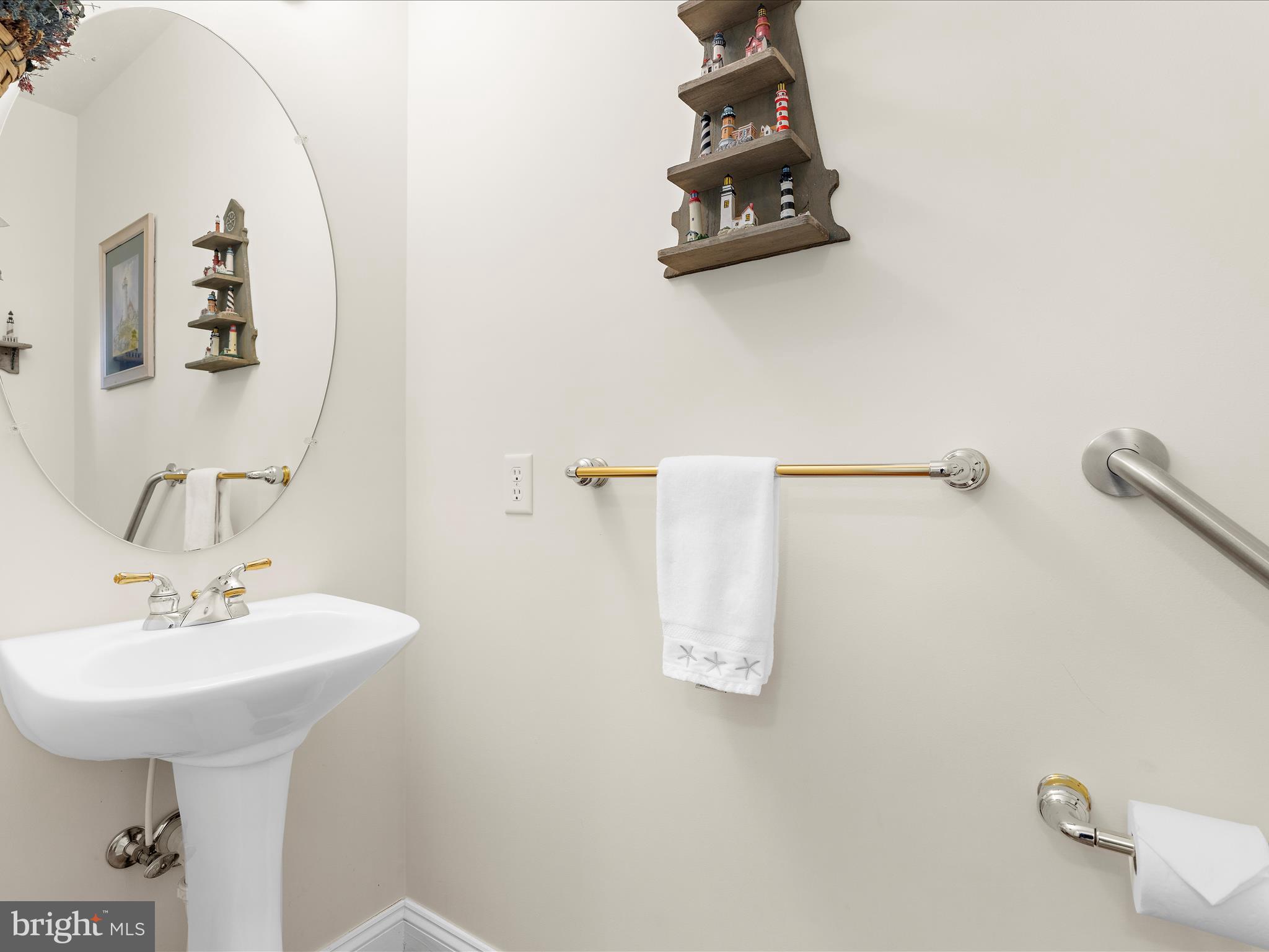 7659 Porcelain Tile Court Odenton, MD 21113 - Photo 16 of 49 a bathroom with a sink and mirror