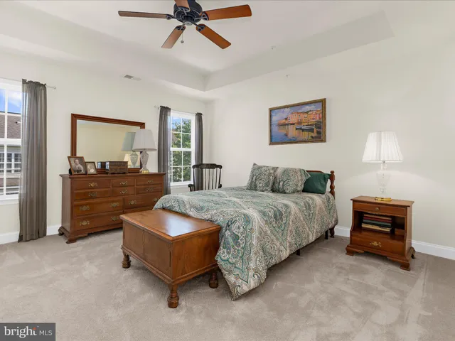 a bedroom with a bed and dresser