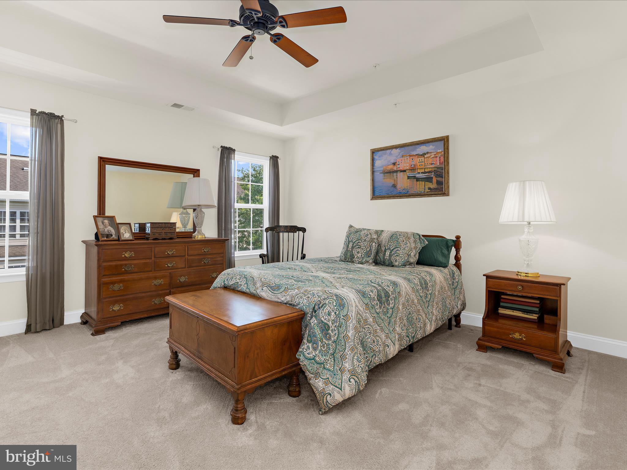 7659 Porcelain Tile Court Odenton, MD 21113 - Photo 18 of 49 a bedroom with a bed and dresser