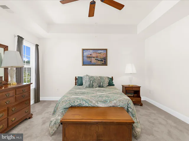 a bedroom with a bed and dresser